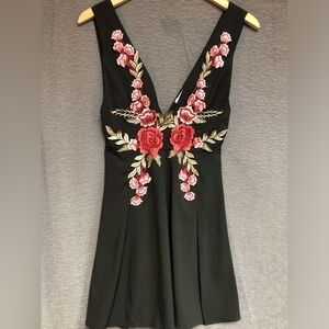 Modern vintage, small black sleeveless dress with embroidery